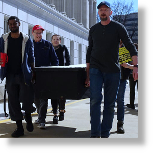 Supporters of the Poor People's Campaign carry a mock casket during a protest at the Missouri Capital  in Jefferson City. 